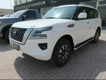 Nissan  Patrol  Titanium  2023  Automatic  0 Km  6 Cylinder  Four Wheel Drive (4WD)  SUV  White  With Warranty