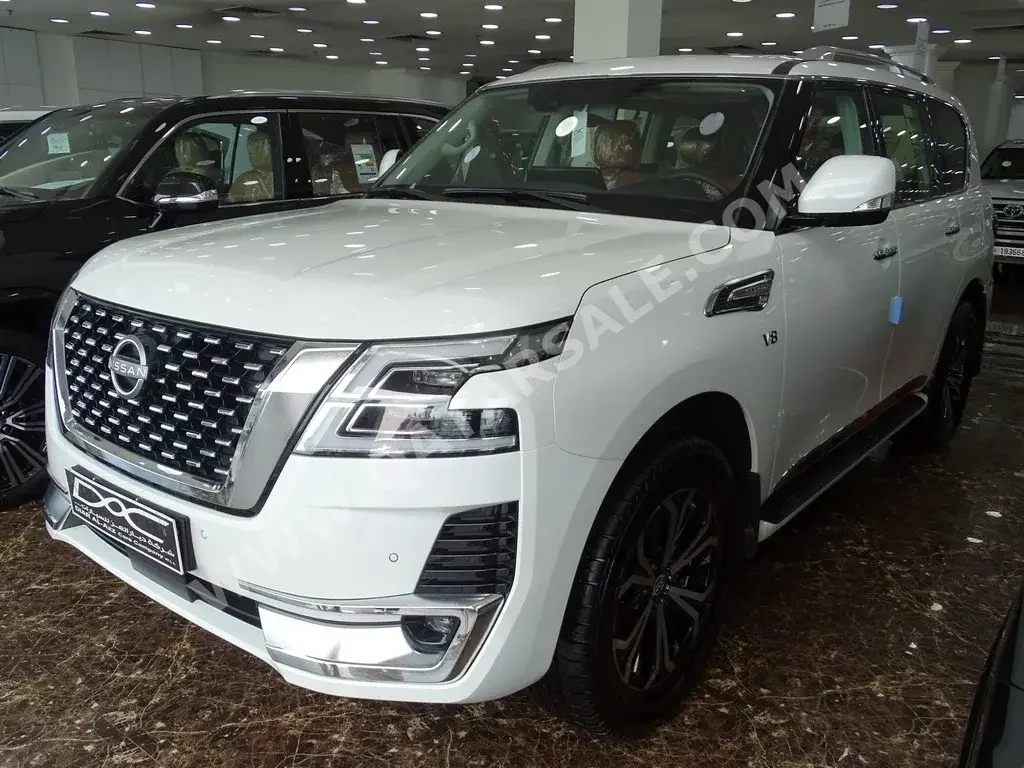 Nissan  Patrol  Titanium  2023  Automatic  0 Km  8 Cylinder  Four Wheel Drive (4WD)  SUV  White  With Warranty