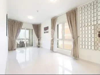 2 Bedrooms  Apartment  For Rent  in Doha -  The Pearl  Semi Furnished