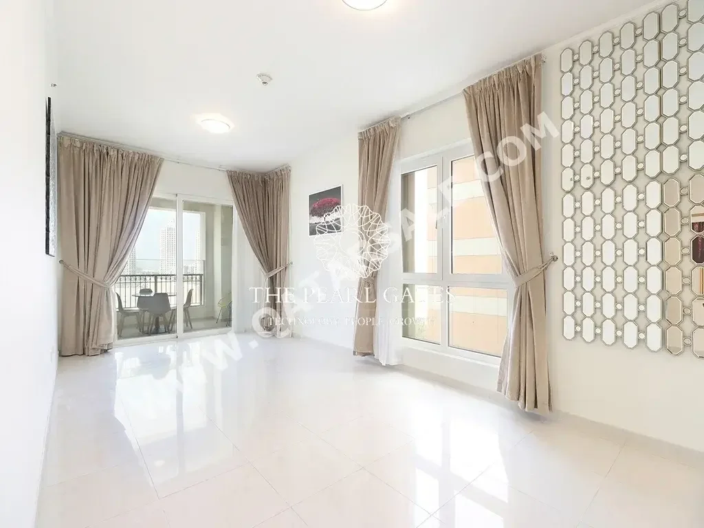 2 Bedrooms  Apartment  For Rent  in Doha -  The Pearl  Semi Furnished