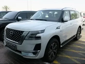 Nissan  Patrol  Titanium  2023  Automatic  0 Km  8 Cylinder  Four Wheel Drive (4WD)  SUV  White  With Warranty