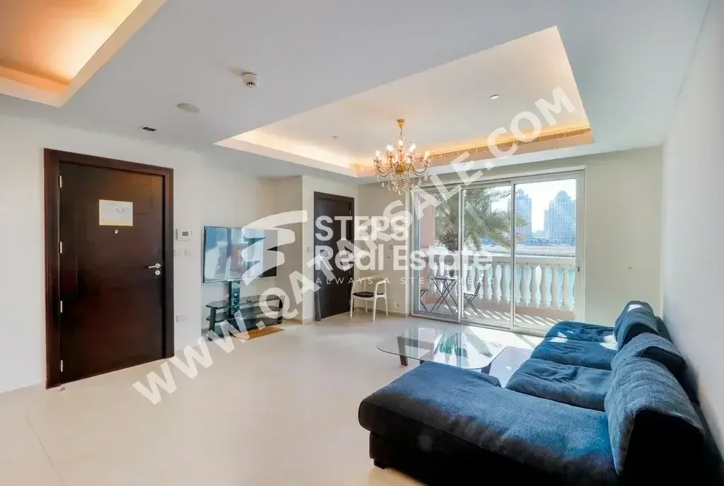 2 Bedrooms  Apartment  For Rent  in Doha -  The Pearl  Semi Furnished