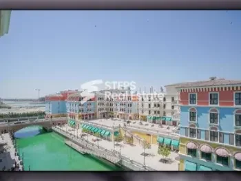 2 Bedrooms  Apartment  For Rent  in Doha -  The Pearl  Semi Furnished