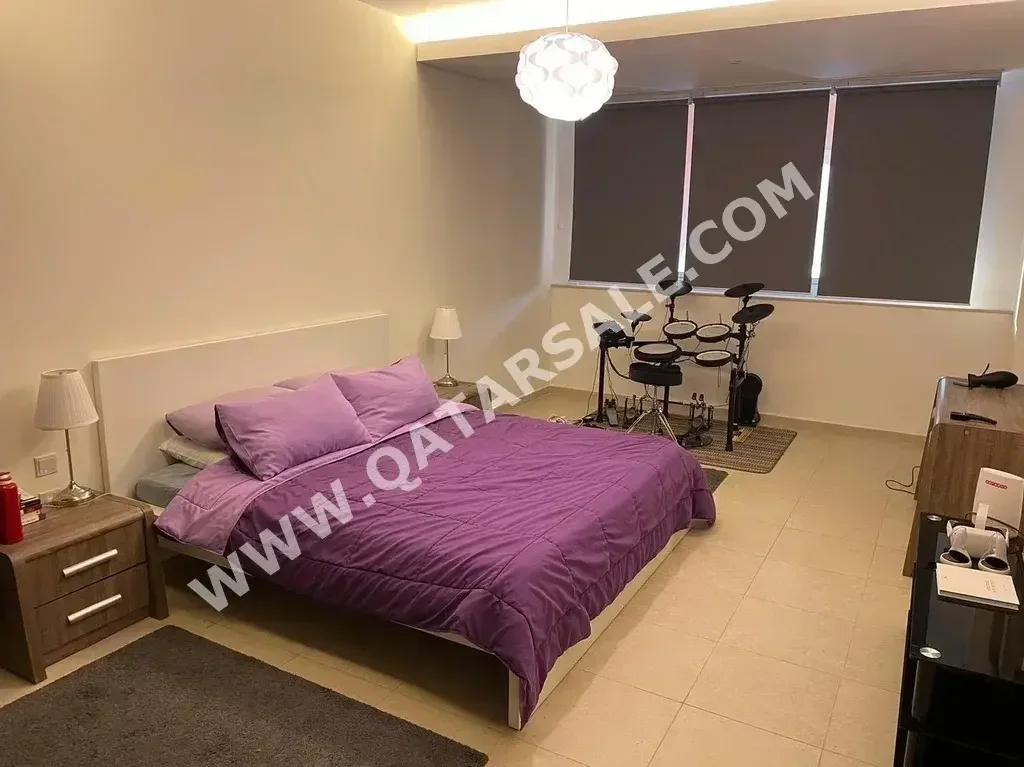 2 Bedrooms  Apartment  For Rent  in Doha -  The Pearl  Fully Furnished