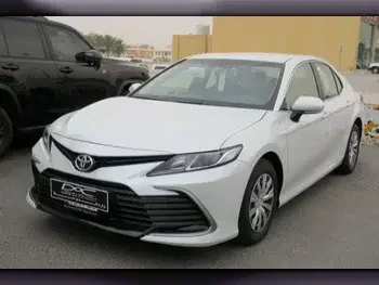 Toyota  Camry  LE  2023  Automatic  0 Km  4 Cylinder  Front Wheel Drive (FWD)  Sedan  White  With Warranty