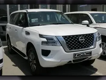 Nissan  Patrol  XE  2023  Automatic  0 Km  6 Cylinder  Four Wheel Drive (4WD)  SUV  White  With Warranty