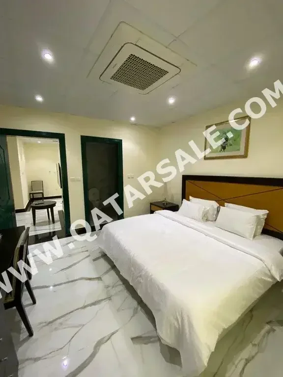 2 Bedrooms  Apartment  For Rent  in Doha -  Al Mansoura  Fully Furnished