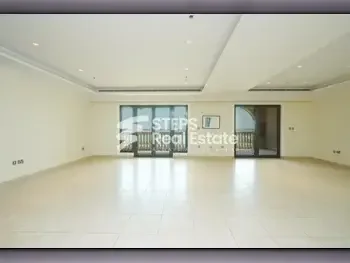 2 Bedrooms  Apartment  For Rent  in Doha -  The Pearl  Semi Furnished