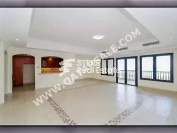 2 Bedrooms  Apartment  For Rent  in Doha -  The Pearl  Semi Furnished