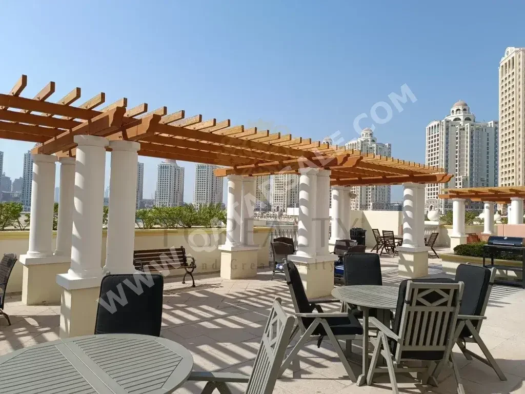 2 Bedrooms  Apartment  For Rent  in Doha -  The Pearl  Not Furnished