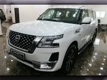 Nissan  Patrol  Titanium  2023  Automatic  0 Km  8 Cylinder  Four Wheel Drive (4WD)  SUV  White  With Warranty