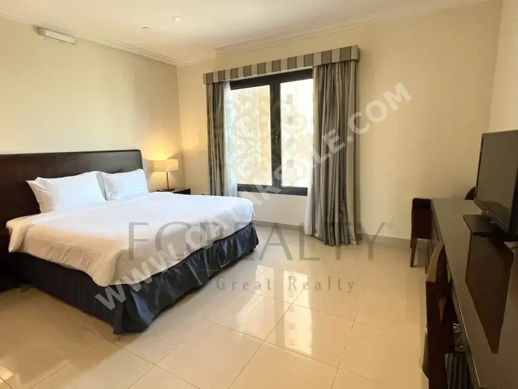 2 Bedrooms  Apartment  For Rent  in Doha -  The Pearl  Fully Furnished