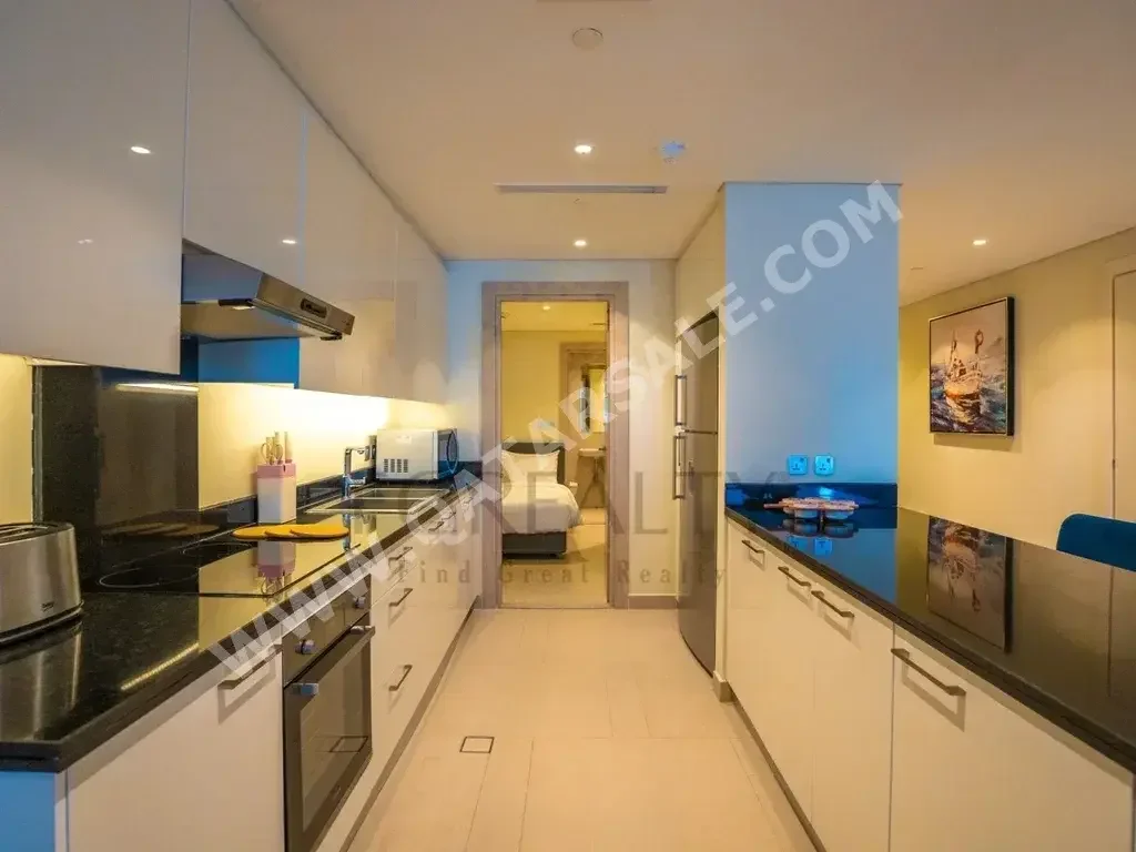 3 Bedrooms  Apartment  For Rent  in Doha -  The Pearl  Fully Furnished