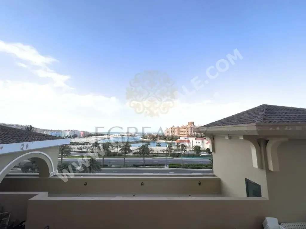 2 Bedrooms  Apartment  For Rent  in Doha -  The Pearl  Not Furnished