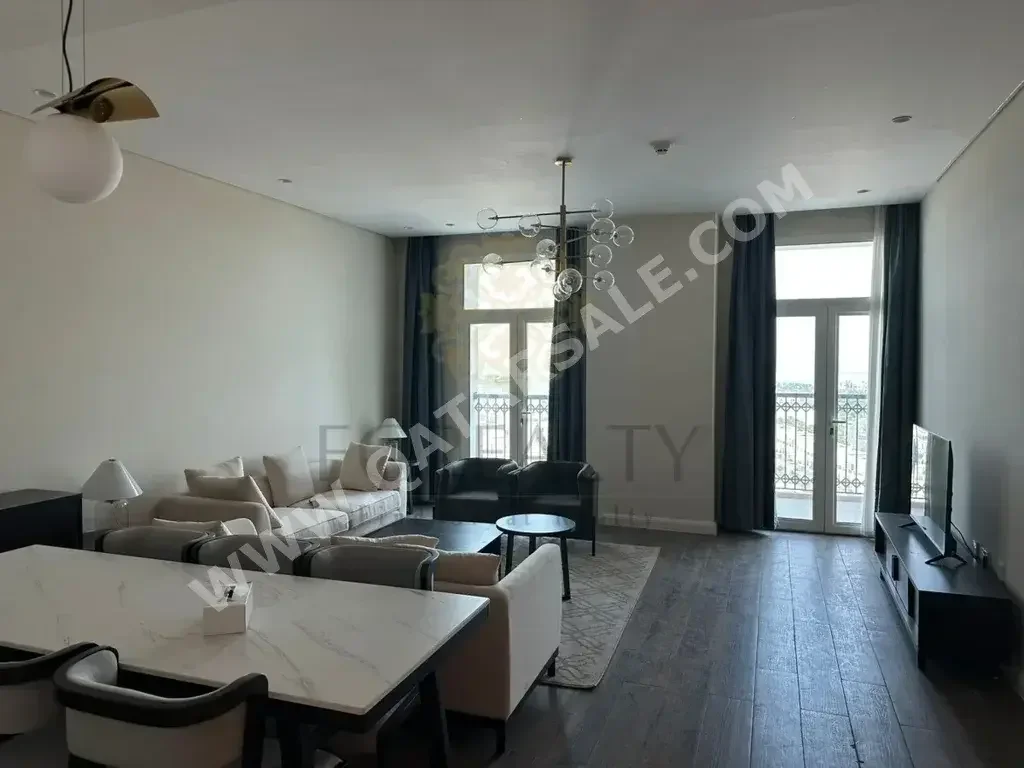 3 Bedrooms  Apartment  For Rent  in Doha -  The Pearl  Fully Furnished