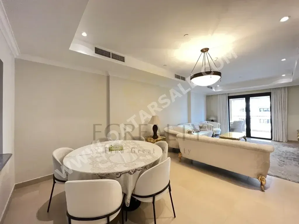 2 Bedrooms  Apartment  For Rent  in Doha -  The Pearl  Fully Furnished