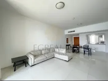 2 Bedrooms  Apartment  For Rent  in Doha -  The Pearl  Semi Furnished