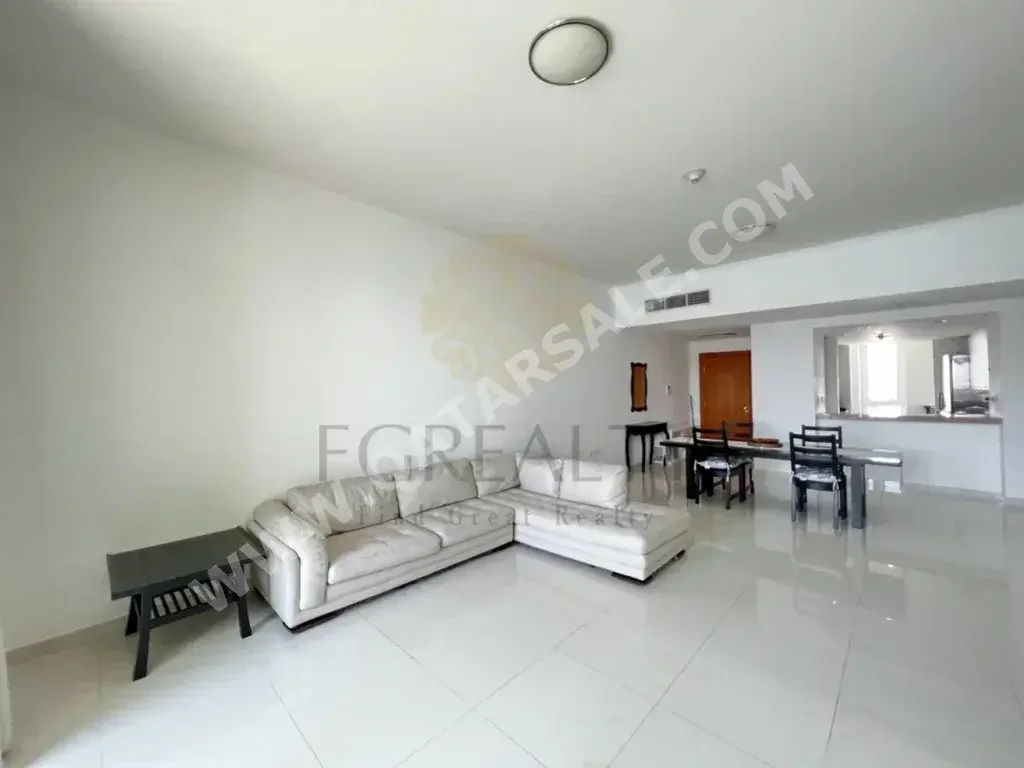 2 Bedrooms  Apartment  For Rent  in Doha -  The Pearl  Semi Furnished