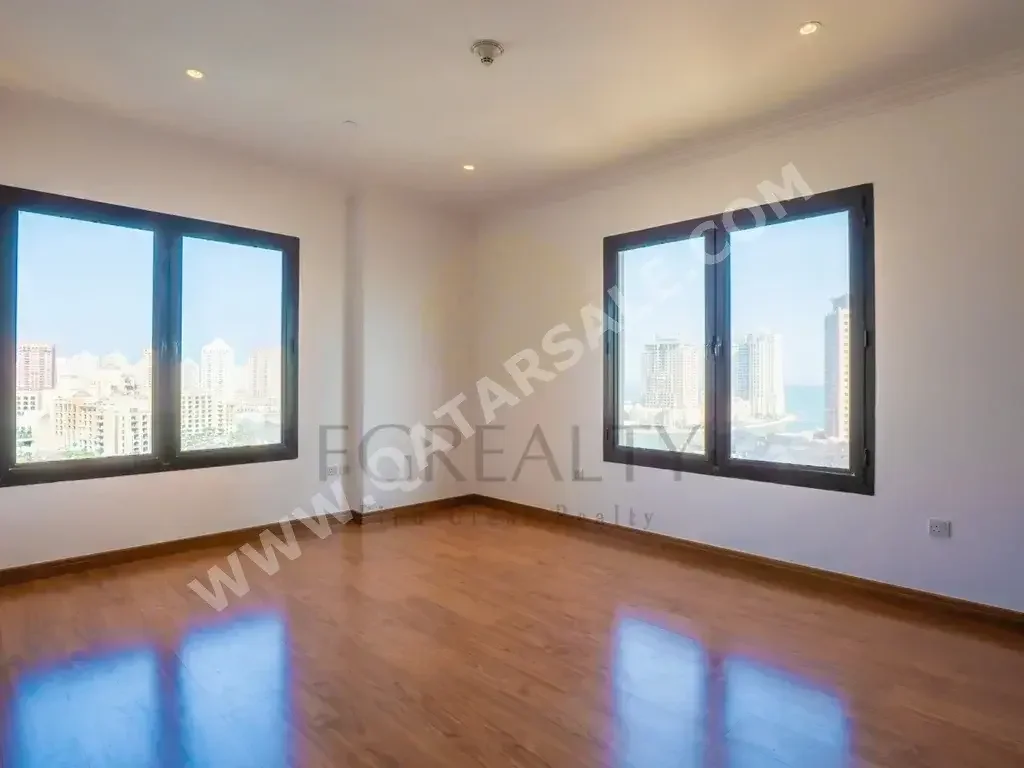 2 Bedrooms  Apartment  For Rent  in Doha -  The Pearl  Not Furnished