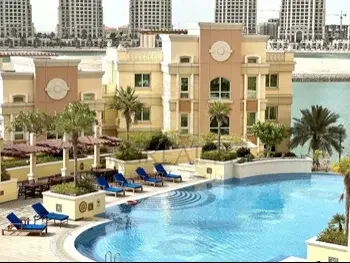 3 Bedrooms  Apartment  For Rent  in Doha -  The Pearl  Not Furnished