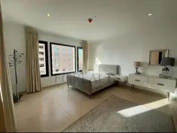 2 Bedrooms  Apartment  For Rent  in Doha -  The Pearl  Fully Furnished