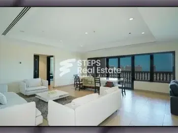 2 Bedrooms  Apartment  For Rent  in Doha -  The Pearl  Fully Furnished