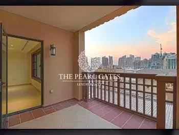 2 Bedrooms  Apartment  For Rent  in Doha -  The Pearl  Semi Furnished