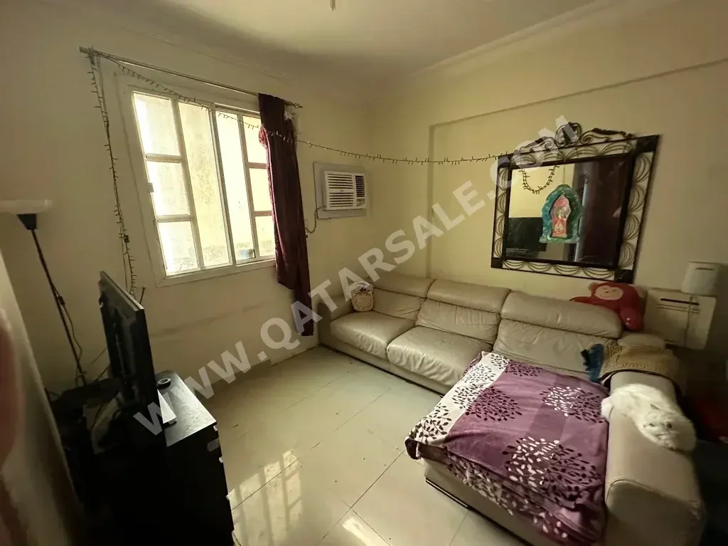 2 Bedrooms  Apartment  For Rent  in Doha -  Al Mansoura  Fully Furnished