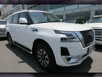 Nissan  Patrol  Titanium  2023  Automatic  0 Km  6 Cylinder  Four Wheel Drive (4WD)  SUV  White  With Warranty