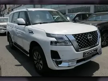 Nissan  Patrol  Titanium  2023  Automatic  0 Km  6 Cylinder  Four Wheel Drive (4WD)  SUV  White  With Warranty