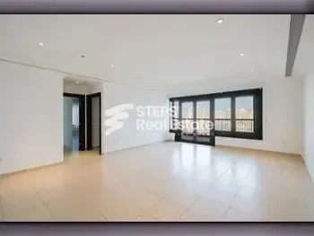 2 Bedrooms  Apartment  For Rent  in Doha -  The Pearl  Semi Furnished