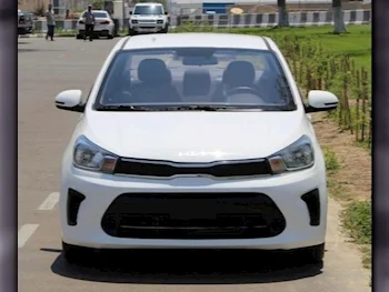 Kia  Pegas  4 Cylinder  Sedan  White  2022