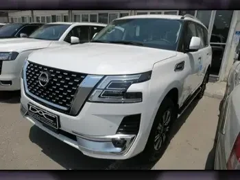 Nissan  Patrol  Titanium  2023  Automatic  0 Km  6 Cylinder  Four Wheel Drive (4WD)  SUV  White  With Warranty