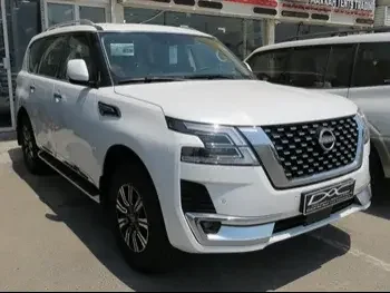 Nissan  Patrol  Titanium  2023  Automatic  0 Km  6 Cylinder  Four Wheel Drive (4WD)  SUV  White  With Warranty