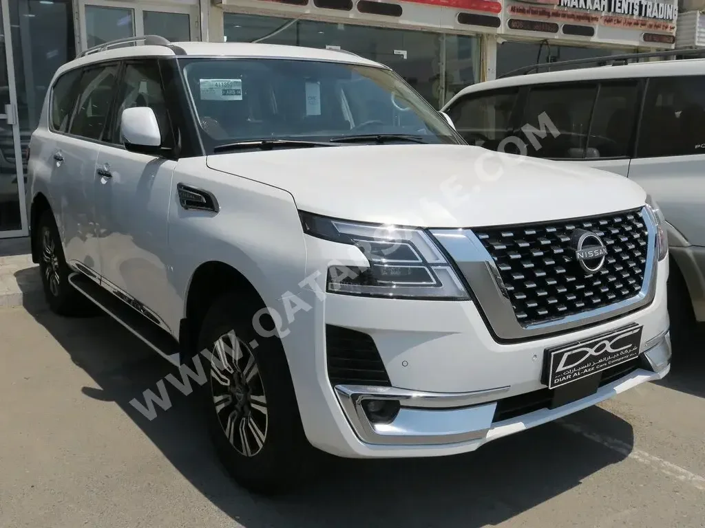 Nissan  Patrol  Titanium  2023  Automatic  0 Km  6 Cylinder  Four Wheel Drive (4WD)  SUV  White  With Warranty