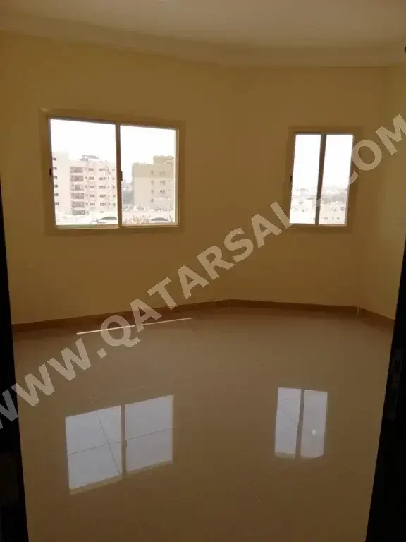 3 Bedrooms  Apartment  For Rent  in Doha -  Al Mansoura  Not Furnished