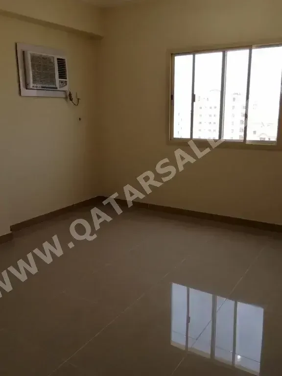 2 Bedrooms  Apartment  For Rent  in Doha -  Al Mansoura  Not Furnished