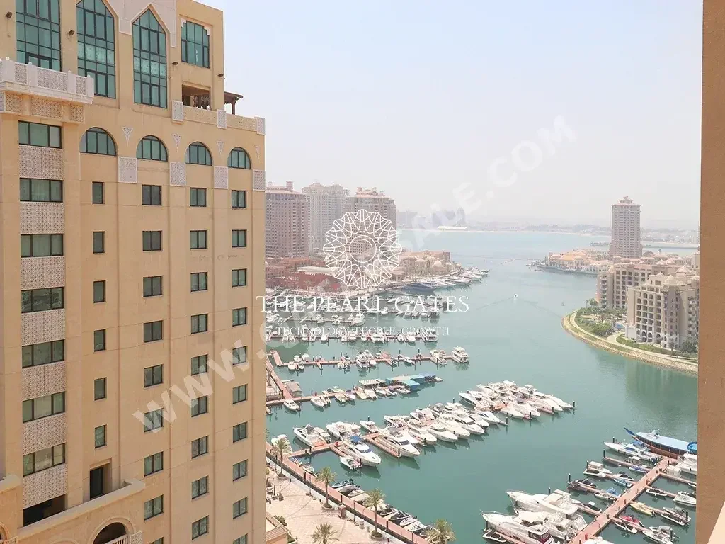 2 Bedrooms  Apartment  For Rent  in Doha -  The Pearl  Semi Furnished