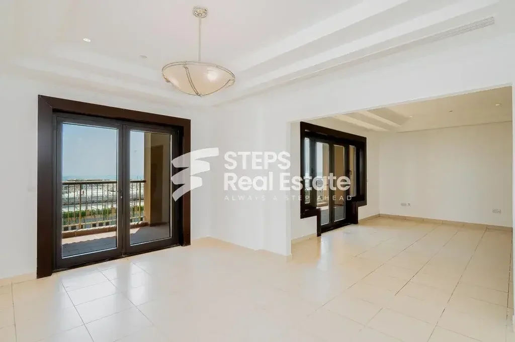 2 Bedrooms  Apartment  For Rent  in Doha -  The Pearl  Semi Furnished