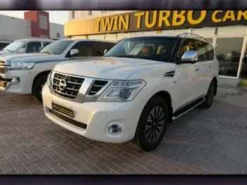 Nissan  Patrol  Platinum  2015  Automatic  158,000 Km  8 Cylinder  Four Wheel Drive (4WD)  SUV  White  With Warranty