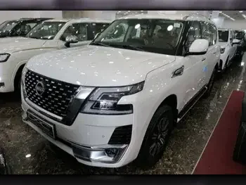 Nissan  Patrol  Titanium  2023  Automatic  0 Km  6 Cylinder  Four Wheel Drive (4WD)  SUV  White  With Warranty