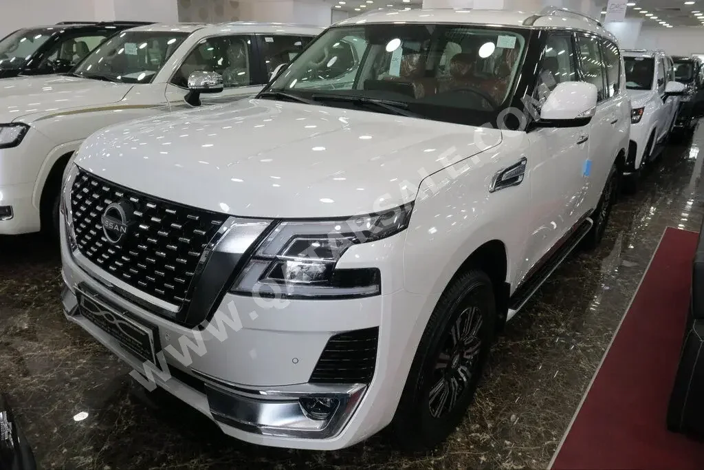 Nissan  Patrol  Titanium  2023  Automatic  0 Km  6 Cylinder  Four Wheel Drive (4WD)  SUV  White  With Warranty