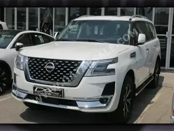 Nissan  Patrol  Titanium  2023  Automatic  0 Km  8 Cylinder  Four Wheel Drive (4WD)  SUV  White  With Warranty