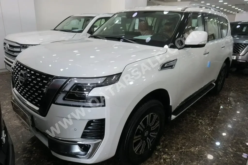 Nissan  Patrol  Titanium  2023  Automatic  0 Km  6 Cylinder  Four Wheel Drive (4WD)  SUV  White  With Warranty