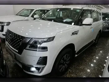 Nissan  Patrol  Titanium  2023  Automatic  0 Km  6 Cylinder  Four Wheel Drive (4WD)  SUV  White  With Warranty