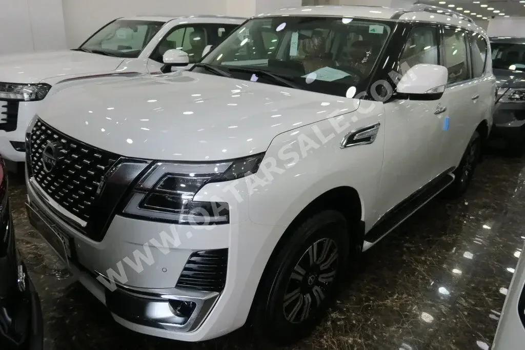 Nissan  Patrol  Titanium  2023  Automatic  0 Km  6 Cylinder  Four Wheel Drive (4WD)  SUV  White  With Warranty