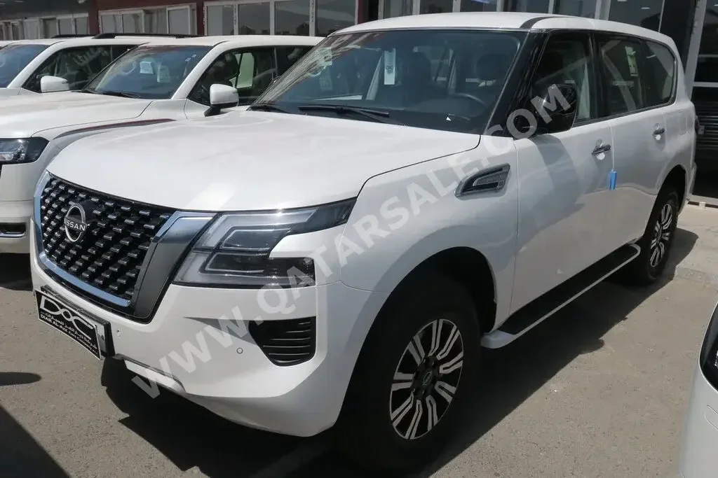 Nissan  Patrol  XE  2023  Automatic  0 Km  6 Cylinder  Four Wheel Drive (4WD)  SUV  White  With Warranty