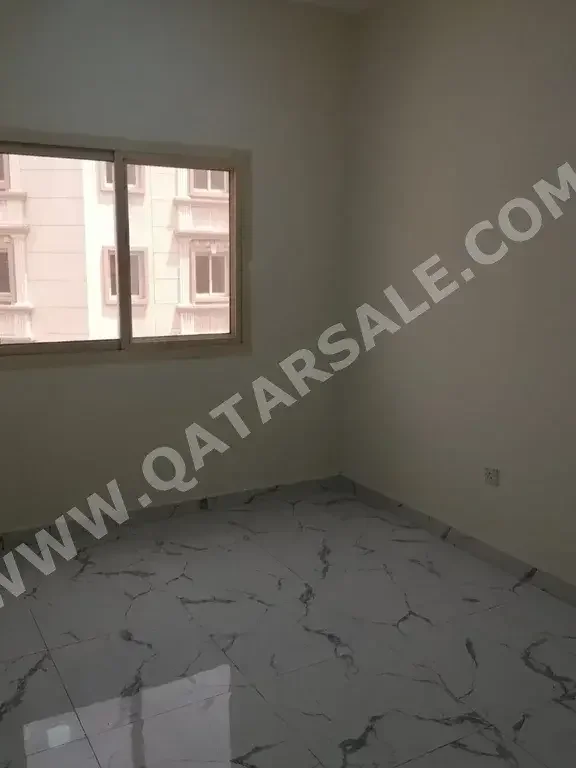 2 Bedrooms  Apartment  For Rent  in Doha -  Al Mansoura  Not Furnished