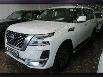 Nissan  Patrol  Titanium  2023  Automatic  0 Km  6 Cylinder  Four Wheel Drive (4WD)  SUV  White  With Warranty