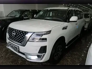 Nissan  Patrol  Titanium  2023  Automatic  0 Km  6 Cylinder  Four Wheel Drive (4WD)  SUV  White  With Warranty